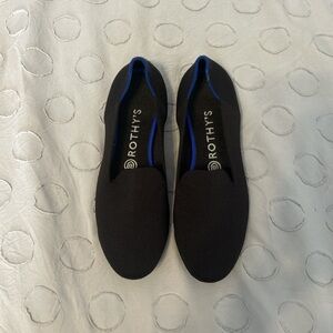 Rothy's Black Slip-Ons with Blue Trim
